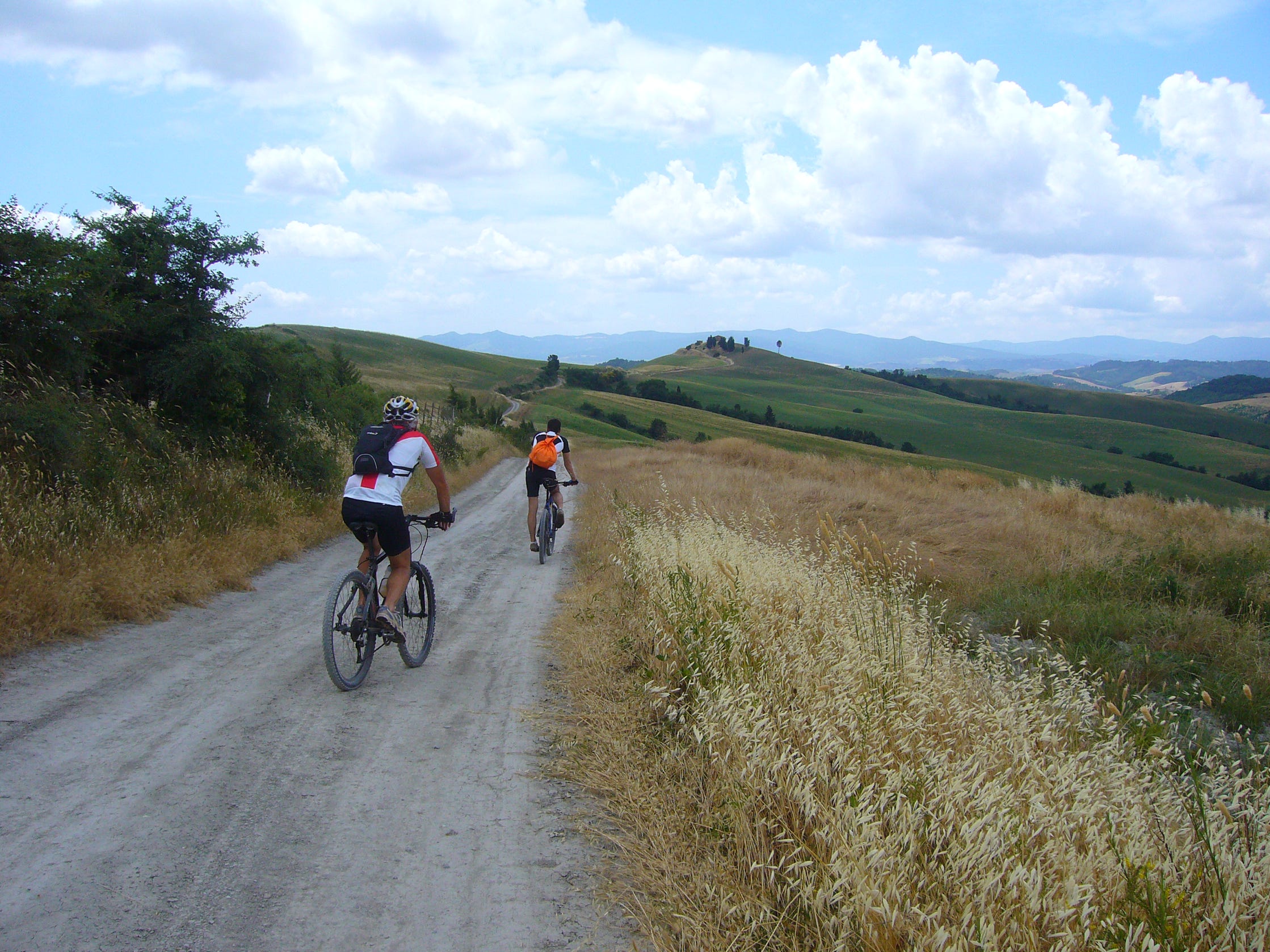 cycling across the scenic white roads of Tuscany during the Crete Senesi bike tour